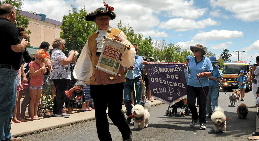 Town crier Bob Townsend plays his part in the parade. Town crier Bob Townsend plays his part in the parade.